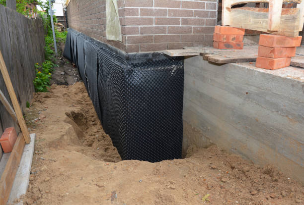 Happy homeowners after waterproofing job in Chesterhill